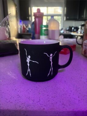 Matte Black Ceramic Mug with Dancing Skeletons - White Interior